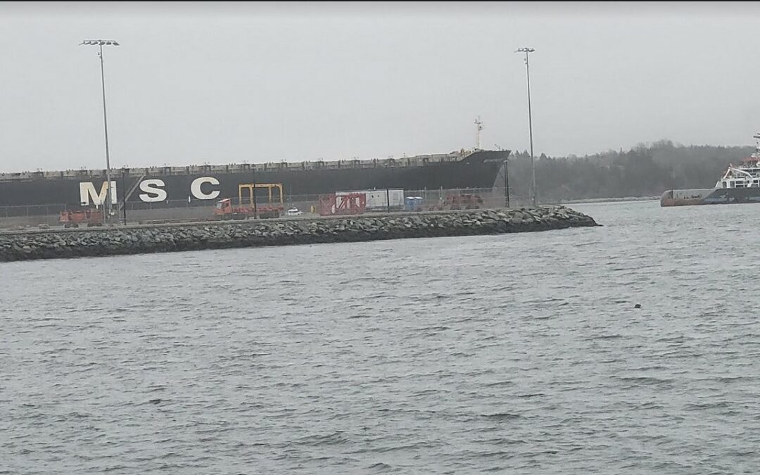 Cargo Unloaded, Fire Stricken Container Vessel Leaves Port of Halifax under tugboat tow